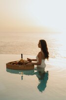 Outdoor pool, open 9:00 AM to 6:00 PM, cabanas (surcharge)