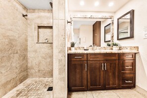 Shower, hair dryer, towels, shampoo