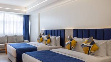 Deluxe Room | 1 bedroom, in-room safe, desk, blackout drapes