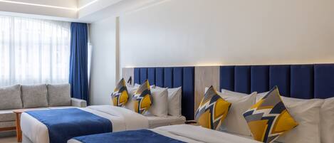 Deluxe Room | 1 bedroom, in-room safe, desk, blackout curtains