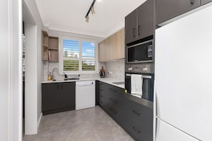 Private kitchen - Eight76 Pacific - Modern Coastal Escape (Port Macquarie)