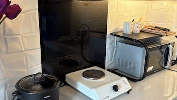 Fridge, microwave, highchair, cookware/dishes/utensils