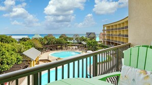 A resort with a pool, multiple buildings, and a view of the ocean. - Beach Resort 402 - Gulf View, Zero-Entry Lagoon Pool, Hot Tub, Deeded Beach! (Miramar Beach)
