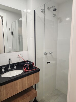 Shower, rainfall showerhead, hair dryer, towels