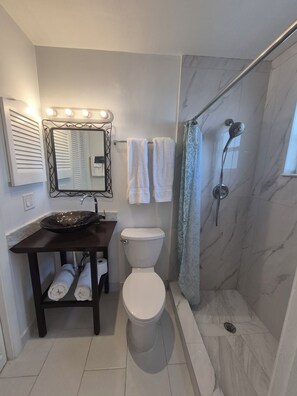 Shower, hair dryer, towels, soap