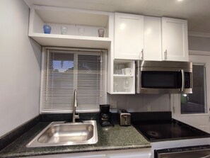Fridge, microwave, stovetop, dishwasher - Water View Studio near downtown  (Jensen Beach)