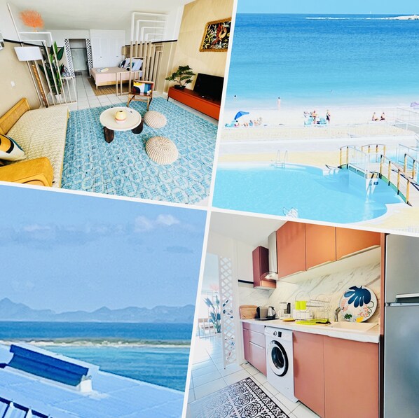 Ein Hotelzimmer mit Bett, kleinem Tisch, Stuhl, Fernseher und Blick auf den Strand.