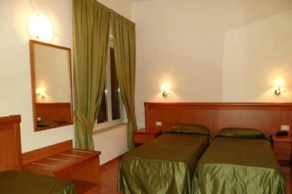 Classic Triple Room | Minibar, in-room safe, desk, soundproofing