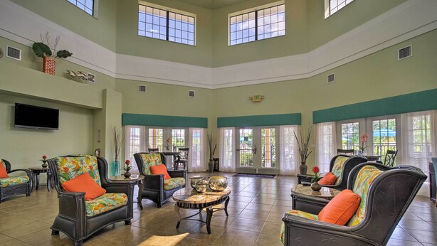 A spacious lobby with high ceilings, large windows, and comfortable seating areas. - 2 Mi to Animal Kingdom: Kissimmee Resort Condo! (Kissimmee)