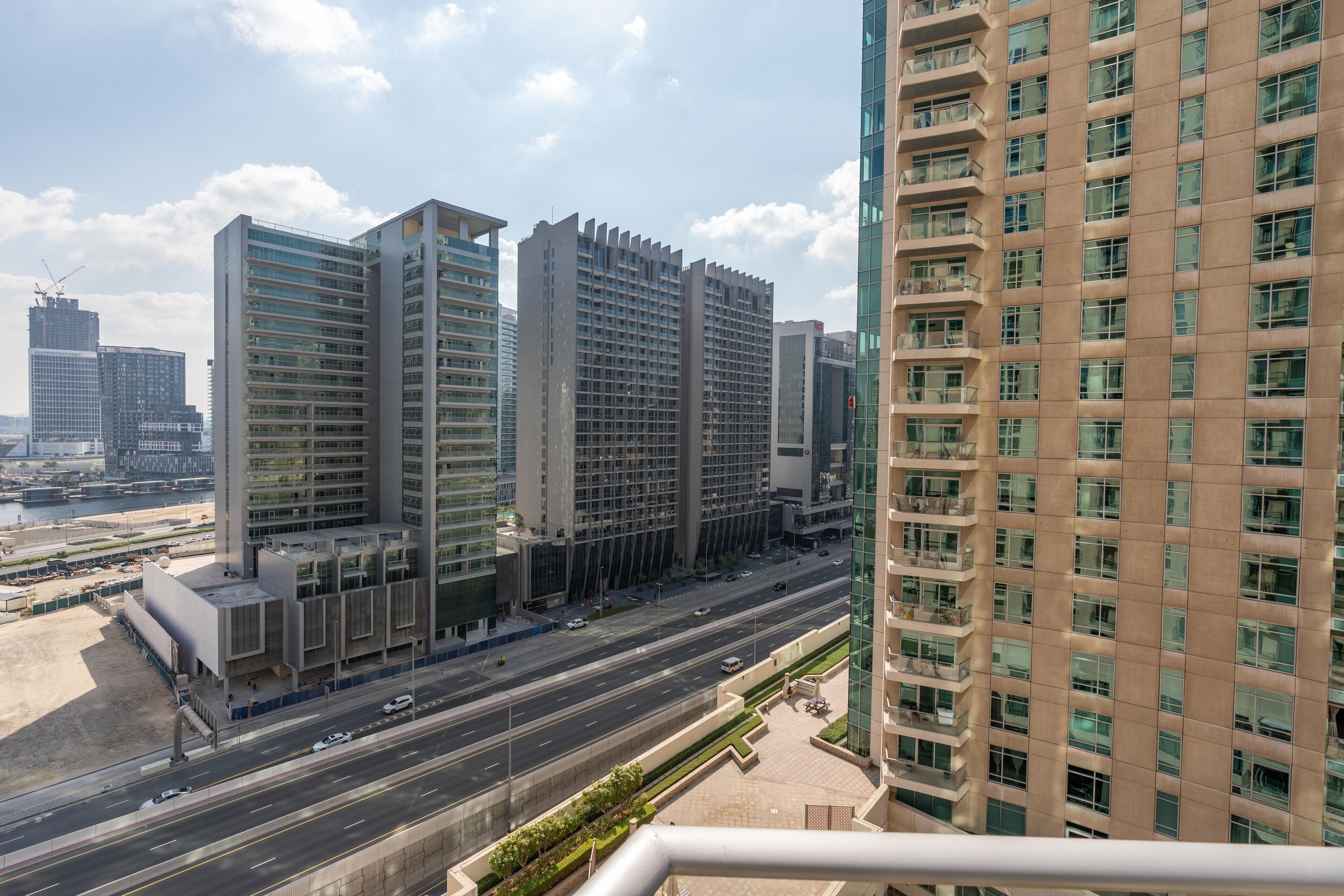 A high-rise building with multiple floors, large windows, and a modern architectural design.