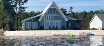 Lake front living with private sandy beach!