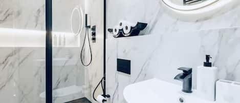 Hair dryer, towels, soap, shampoo