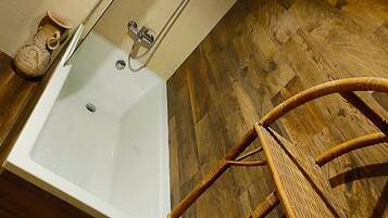 Shower, hair dryer, soap, toilet paper