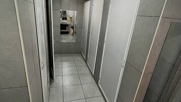 Shower, hair dryer, towels, toilet paper