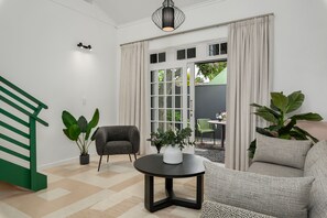 Deluxe Loft | Living area | 54-inch Smart TV with digital channels