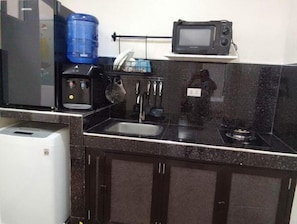 Fridge, microwave, cookware/dishes/utensils