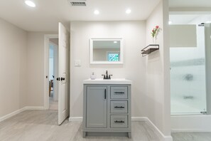 Shower, hair dryer, towels, soap