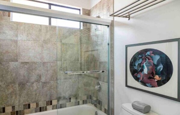 A modern bathroom with a glass-enclosed shower, a bathtub, and a framed abstract painting on the wall. - Main House + Guest Unit! 5 Bed / 3.5 Bath, Oakland Hills (Oakland)