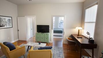 Junior Suite | Living area | 43-inch Smart TV with cable channels