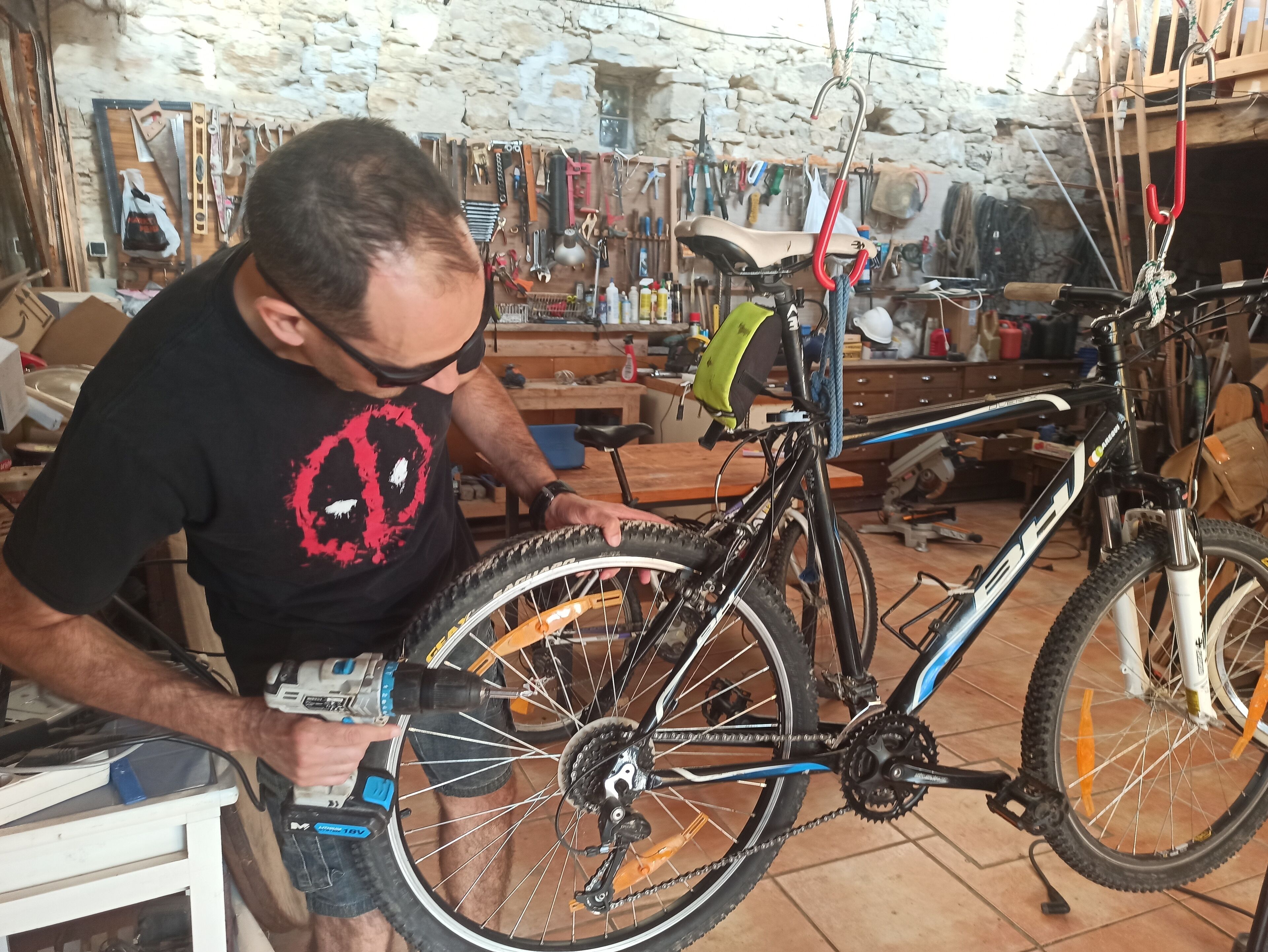 A workshop with a bicycle being serviced.