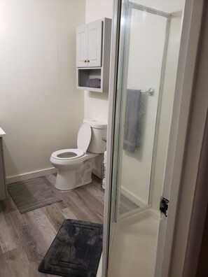 Shower, eco-friendly toiletries, towels, soap