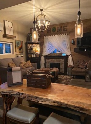 Smart TV, fireplace, books, music library