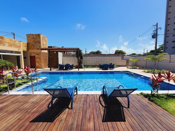 Outdoor pool, open 8:00 AM to 10:00 PM, sun loungers