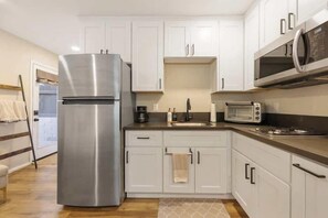 Fridge, coffee/tea maker, cookware/dishes/utensils