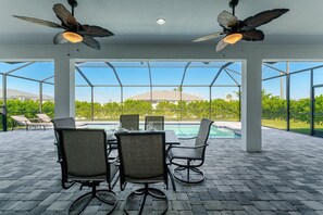 Outdoor dining - Heated Pool & Modern Upgrades! - Villa Moonlight Breeze - Roelens Vacations (Cape Coral)