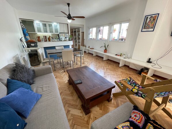Relax in this inviting living space with a sofa, coffee table, and comfortable chair.