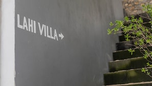 A sign reading "LAHI VILLA" with a staircase leading up. - Lahi Villa  (Penida Island)