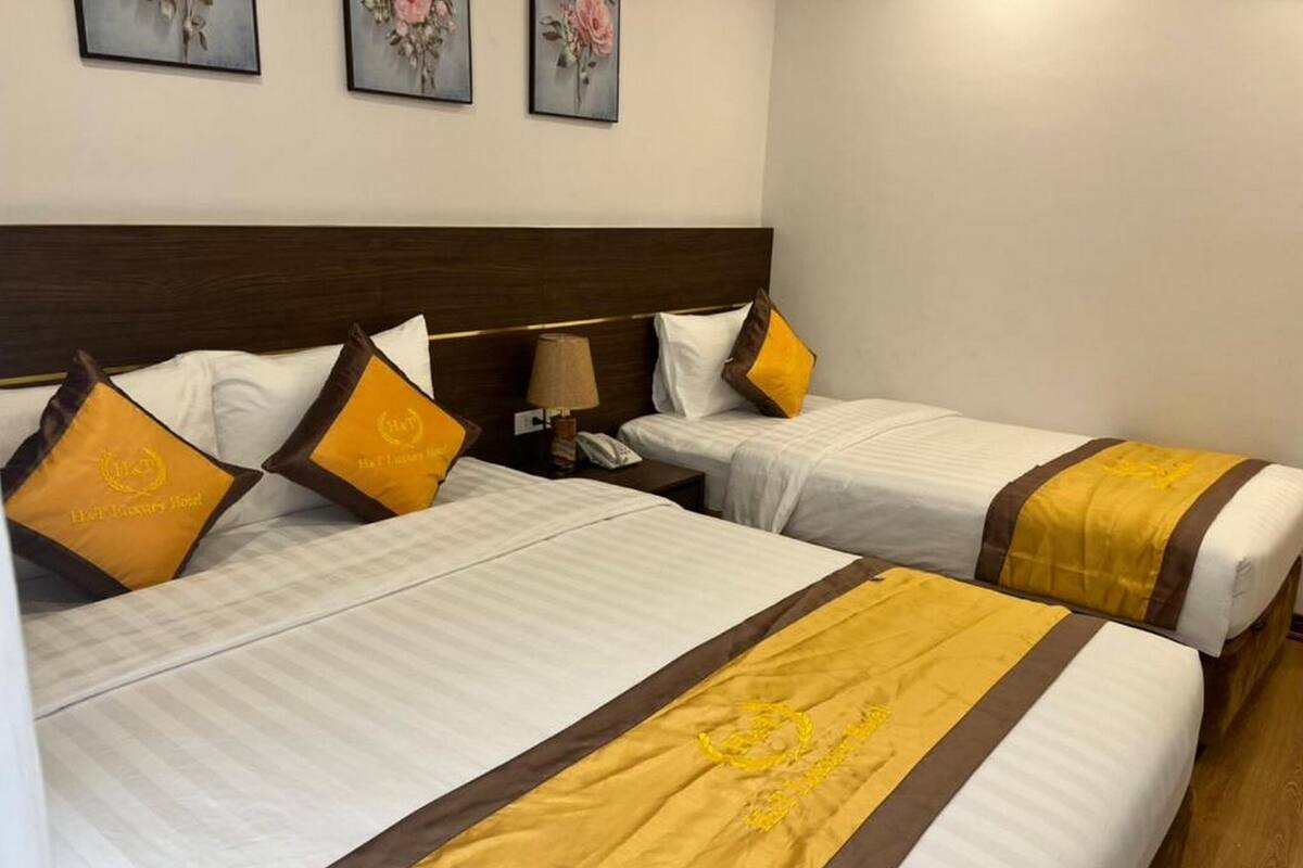 Deluxe Triple Room, Balcony, City View | Minibar, desk, laptop workspace, soundproofing