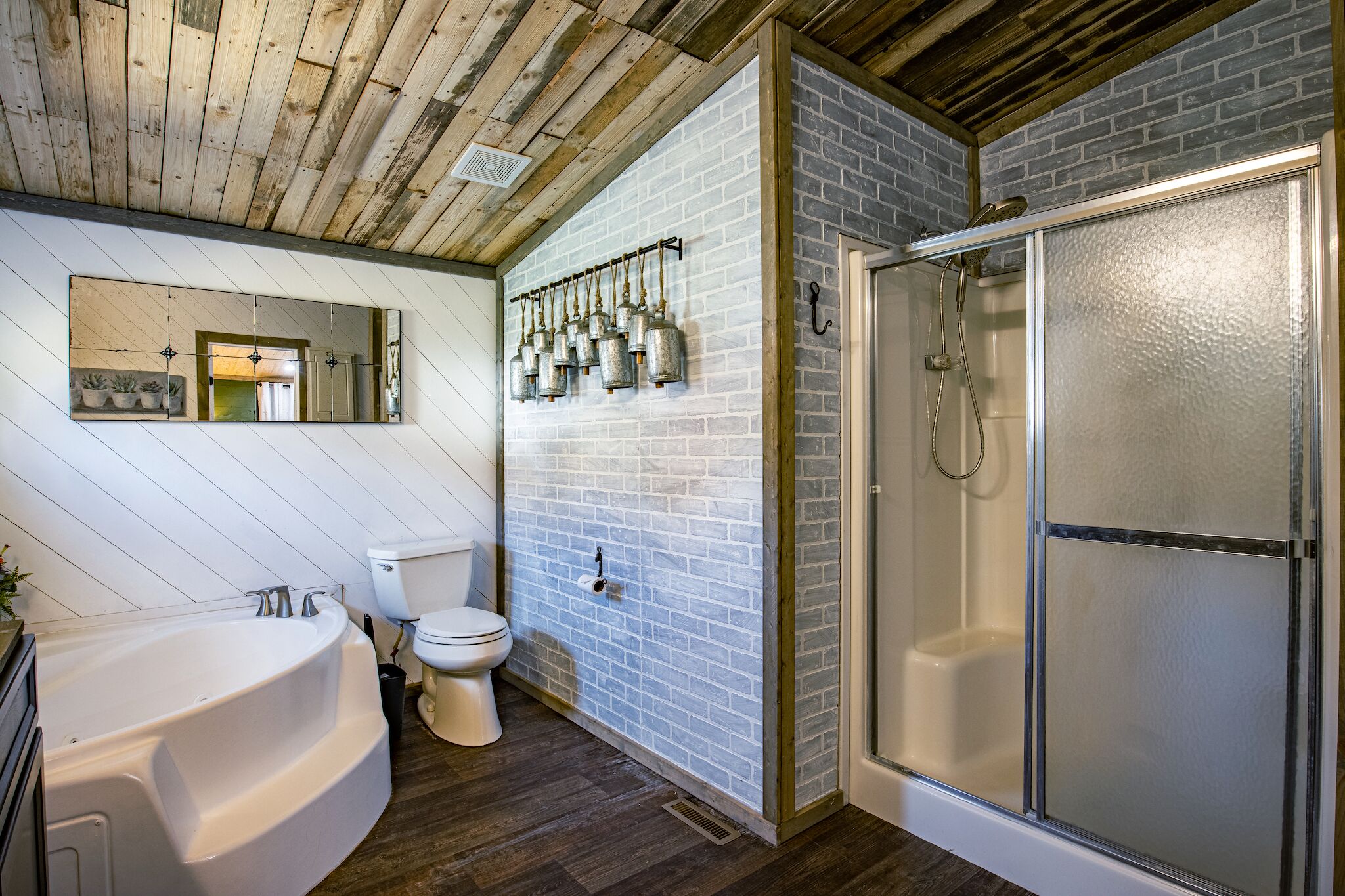 A bathroom with a bathtub, toilet, and shower.