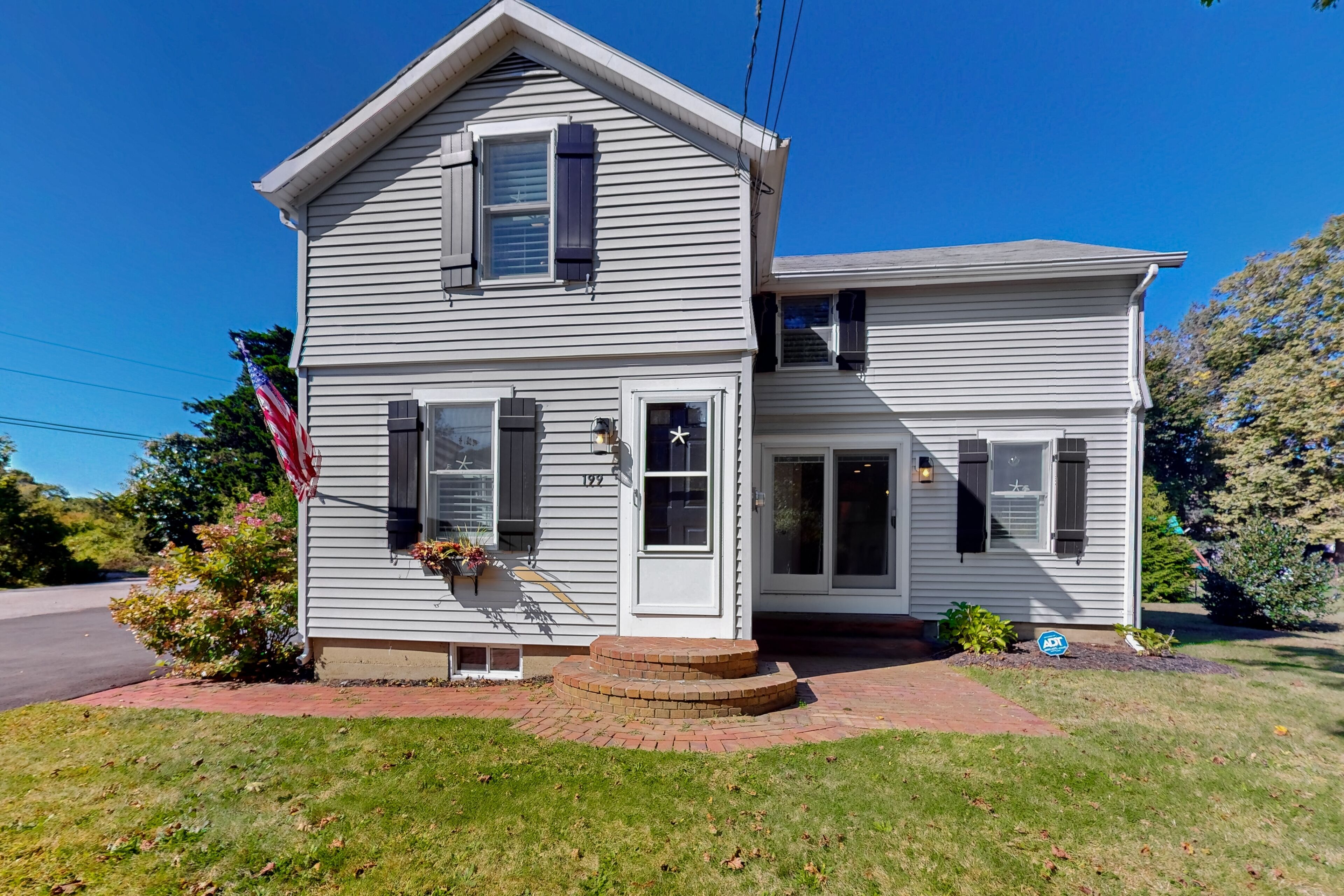 Charming nautical home with large yard, airy interior, streaming, & washer/dryer