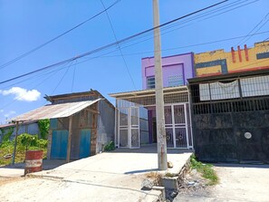 Stroll through a charming neighborhood with a mix of residential and commercial buildings.