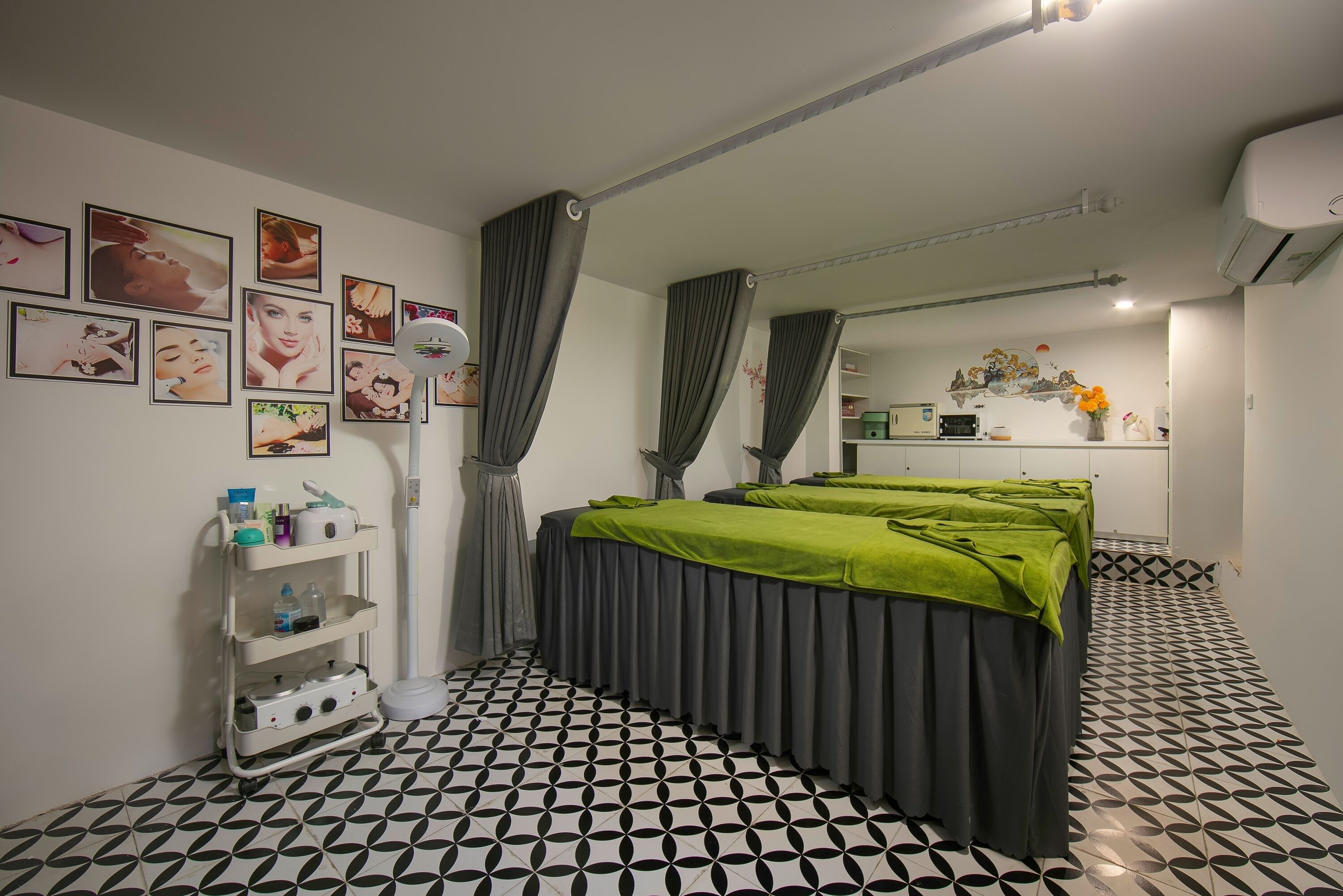A room with a bed, a vanity with a mirror, and a shelf with toiletries.