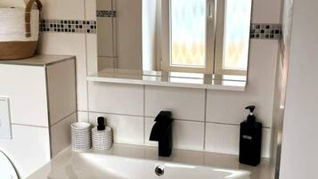 Hair dryer, towels, soap, shampoo