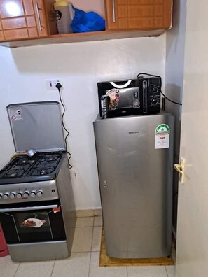 Fridge, microwave, cookware/dishes/utensils