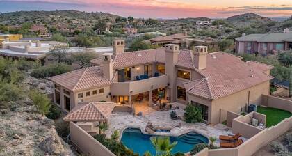 Enjoy breathtaking views of the mountainside throughout this hillside estate.