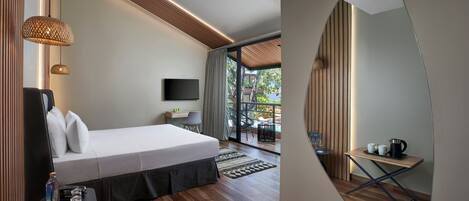 Una habitación de hotel moderna con una cama, un televisor, una mesita con una cafetera y vistas al exterior.