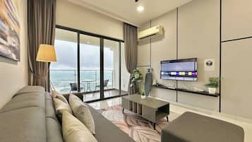 Family Apartment, 3 Bedrooms, Balcony, Sea View | Living area | 55-inch Smart TV with cable channels, Netflix, streaming services