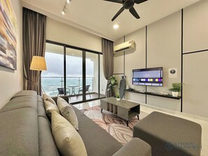 Family Apartment, 3 Bedrooms, Balcony, Sea View | Living area | 55-inch Smart TV with cable channels, Netflix, streaming services