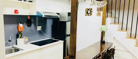 Fridge, microwave, electric kettle, cookware/dishes/utensils