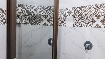 Room, 1 King Bed | Bathroom | Rainfall showerhead, towels, soap, toilet paper