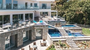 A modern two-story house with a rooftop terrace, outdoor seating, and a swimming pool. - Villa Sacco - Sorrento Coast (Priora)