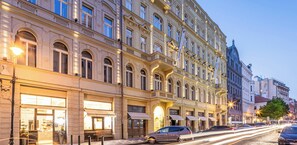 A historic building with ornate architecture, large windows, and a cobblestone street. - Pytloun Bristol Residence Prague (Prague)