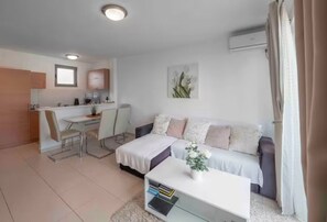 Family Apartment | Living area | 32-inch LCD TV with cable channels - Sunset Seaview Two Bedroom Apartment (Becici)