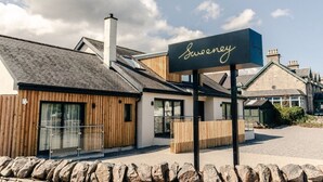 A building with a sign reading "Sweeney" in front. - Sweeney Aviemore One (Aviemore)