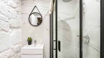 Shower, hair dryer, towels, soap