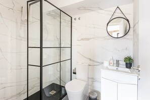 Shower, hair dryer, towels, soap
